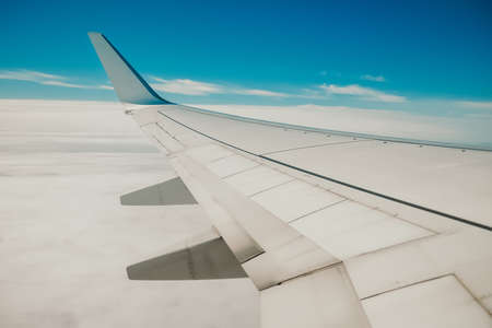 View from jet to sky with clouds. Camera filming from aircraft porthole. Earth landscape through...