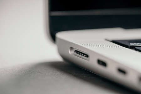 Barcelona, Spain - January 2022. Connector for MagSafe 3 power adapter in new laptop. Charger of...