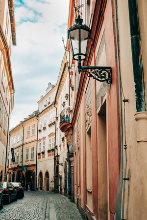 Prague, Czech Republic - July 2022. Beautiful cozy narrow street in old town. Amazing european architecture, historical facades of traditional buildingsのeditorial素材