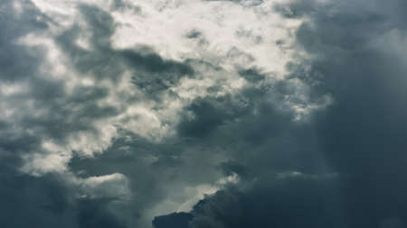 Dramatic clouds on dark stormy sky. Heaven background. Epic cloudscape, thunderstorm backdrop. Sinister elementの写真素材