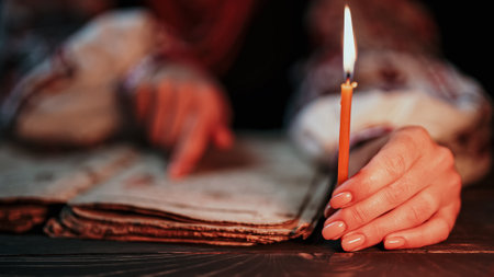 Ukrainian woman reading ancient book - Bible. Concentrated attentively follows finger on paper page...