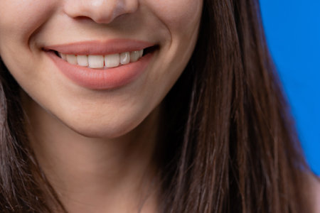 Close-up smiling mouth of woman. Perfect white healthy teeth. Emotional fun and joy lifestyle....