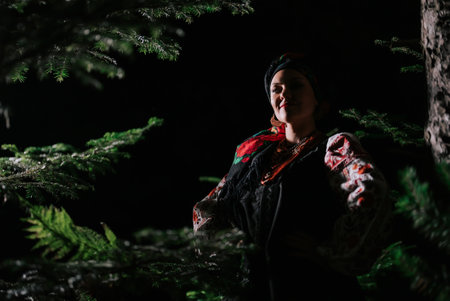 Beautiful woman in traditional ukrainian handkerchief, necklace and costumeの写真素材