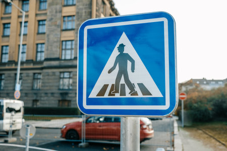 Blue road pedestrian crossing sign, crosswalk, old warning signalの写真素材