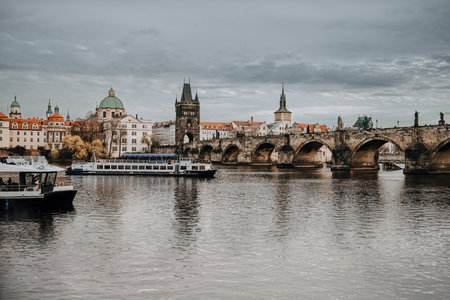 Prague, Czech - February 2023. Boat tours on Vltava river under Charles Bridge