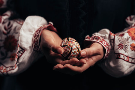 Ukrainian woman hand painted Easter egg. Geometric slavic decoration ornamentsの写真素材