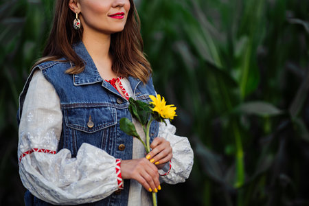 Smiling attractive ukrainian woman on green nature background.Modern ethno styleの写真素材