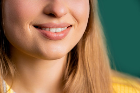 Mouth of charming smiling blonde woman. Perfect healthy teeth, lips, kind smile