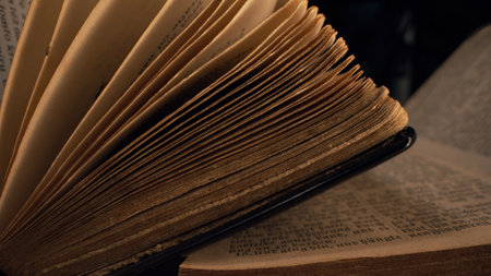 16 February 2024 - Berlin, Germany. Opened saved medieval book with ancient writings. Religious...