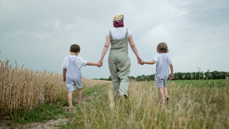Mother Kids Walking On Rural Landscape Path.Ecological Life,Nature Outside Cityの写真素材