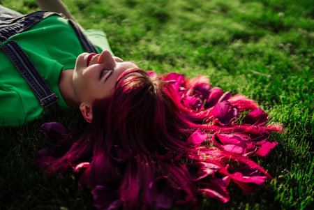 Portrait of real serene woman with vivid dyed pink fuchsia hairstyle. Trendy colorful hair, stylish...