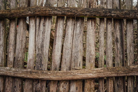 Outdated wooden fence in old village, wood planks, textureの写真素材