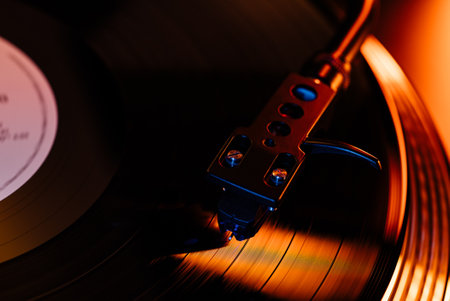 Modern vinyl record, turntable spin, analog sound, music. Vintage aesthetics. LPの写真素材
