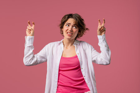Sarcastic woman with hands two fingers air quotes gesture on pink, sarcasmの写真素材