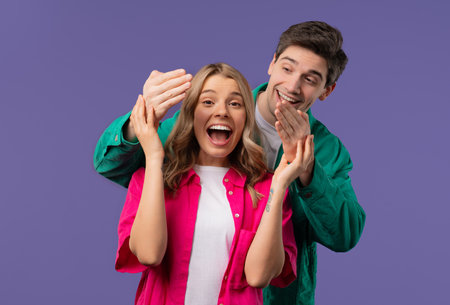 Handsome Man Closes Eyes Of His Beloved Girlfriend Before Surprise. Happy coupleの写真素材