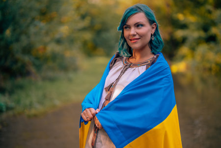 Happy Smiling Ukrainian Woman With National Flag On River Forest Background