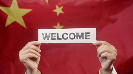 Woman With Welcome Lettering Title Text Cardboard Chinese Flag Background. Chinaの写真素材