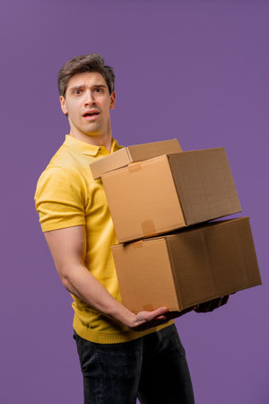 Confused man with heavy parcels boxes. Guy received online purchases.