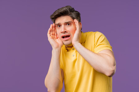 Frightened Man On violet Backdrop. Phobia, Trouble, Panic Concept.の写真素材