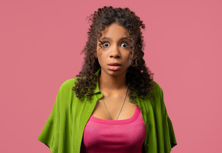 African woman afraid something, shock on pink backdrop.Unbelievable, bad news.の写真素材
