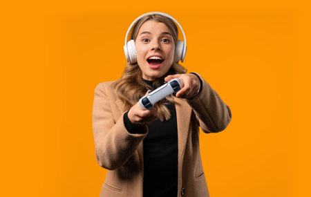 Young gamer woman playing online video game, console with gamepadの写真素材