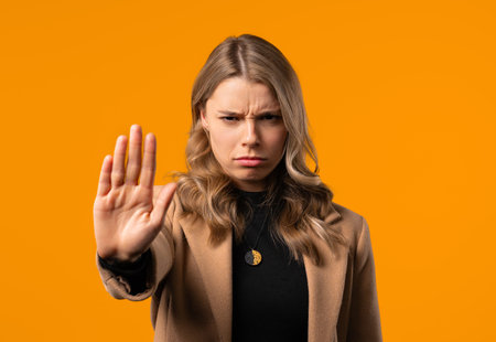 Uninterested businesswoman disapproving with NO sign. Keep your distance, enoughの写真素材