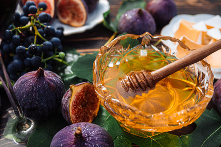 Cheese Platter With Camembert Brie, Healthy Juicy Organic Figs, Honey And Grapesの写真素材