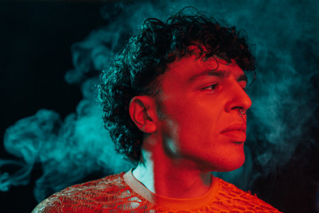 Glamourous Man In Smoke Neon Green Light, Night Club. Portrait Sexy Guy In Smoke
