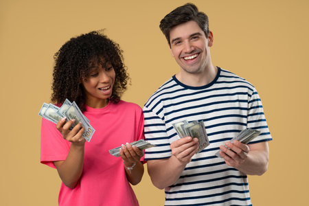 Amazed Happy Excited Interracial Couple Counting Money - Usd Currency Dollarsの写真素材