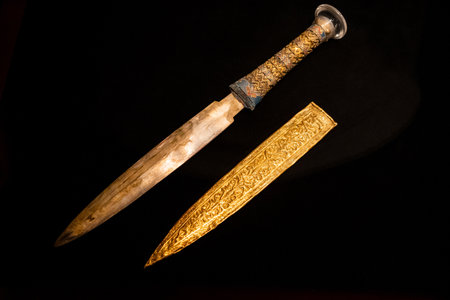 Ancient Egyptian Ceremonial Dagger with Ornate Gold Sheathの写真素材