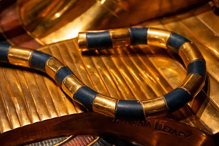 Close-up of golden and blue striped crook from ancient Egyptian pharaoh regaliaの写真素材