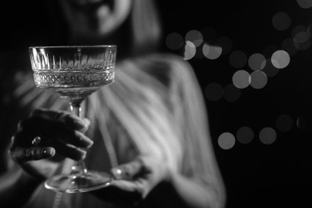 Woman With Champagne In Retro Styled Glass Goblet. Wedding Party Celebration.の写真素材