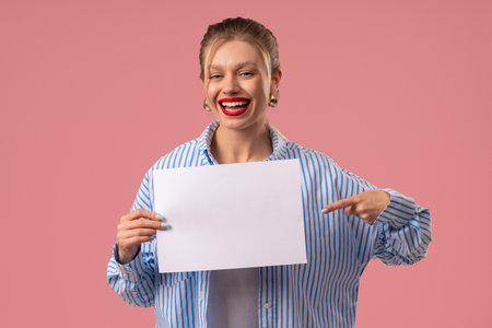Woman Holding Horizontal White A4 Paper Poster. Copy Space. Mock-Up Banner,の写真素材