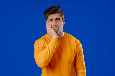 Mature Man Touching Cheek With Painful Expression, Reacting To Sudden Toothache