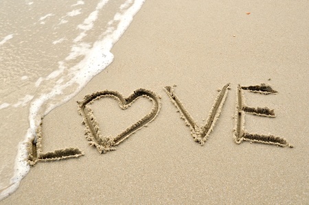 Swash the love on sandの写真素材