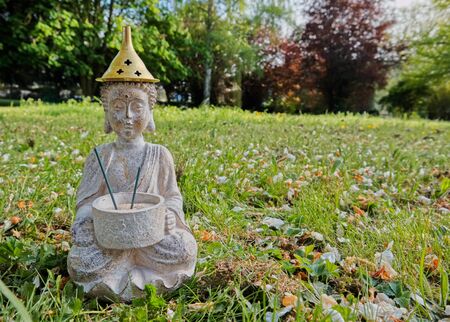 Buddha statue isolated on the fieldの写真素材
