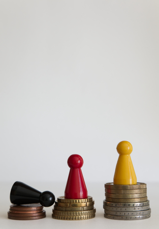 Coins stacks with figure yellow red blackの写真素材