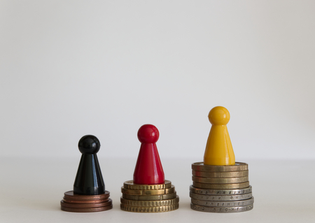 Coins stacks with figure yellow red blackの写真素材