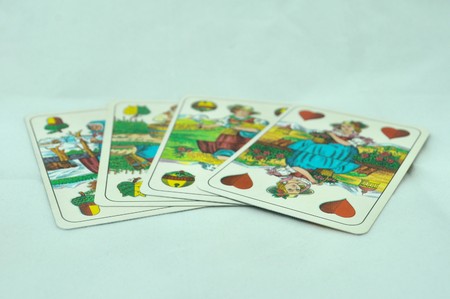 playing cards on white table