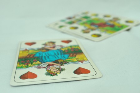 playing cards on white tableのeditorial素材