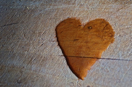 watter heart on old woodの写真素材