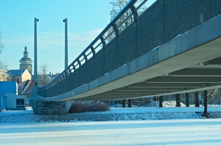 modern bridge in historic townの写真素材