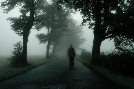 silhouette of man in dark atmosphereの写真素材