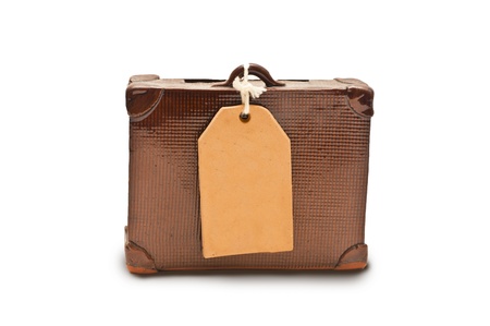 small suitcase with a tag for your textの写真素材