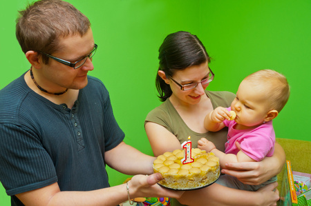 fist birthday with her parentsの写真素材