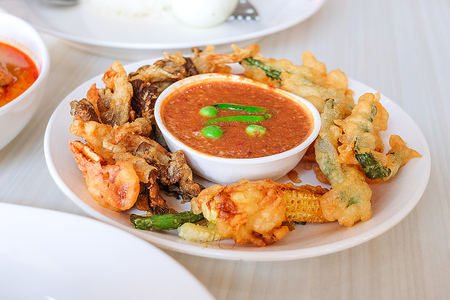 This chili paste thai called "Nam Prik Kapi" served with batter-fried vegetables. Local Cuisine of Thailand.の写真素材
