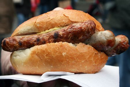 Traditional fast food to go. :three small grilled sausages in a bread. This type of rather small Bratwurst is typical for Nuremberg. It is very tasty. の写真素材