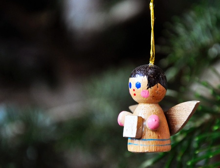 A little Angel, a decoration hanging on a christmas treeの写真素材