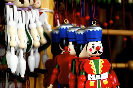 Several different wooden Jumping Jacks hanging in an oldfashioned toy shop
