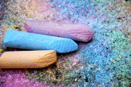 Pieces of colorful chalk on the painted pavementの写真素材
